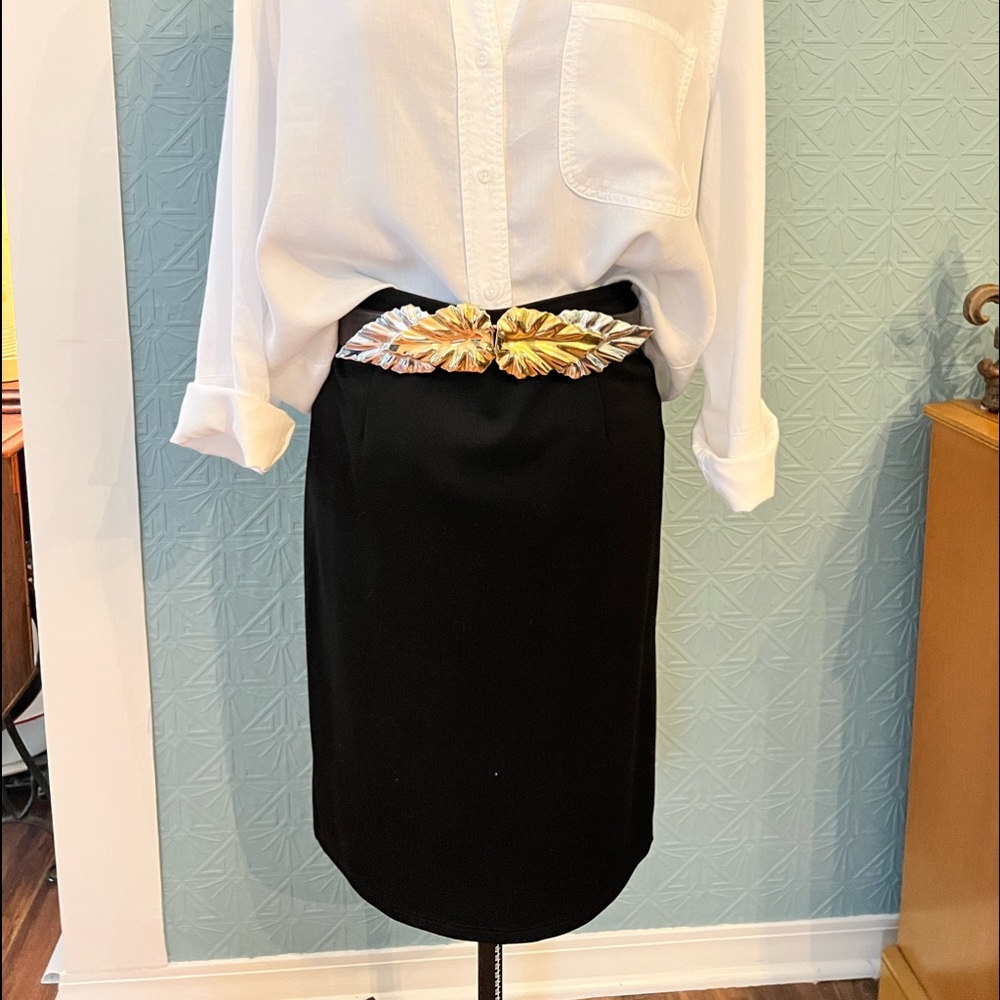 Black knit skirt. Length is just below the knee. Great staple piece